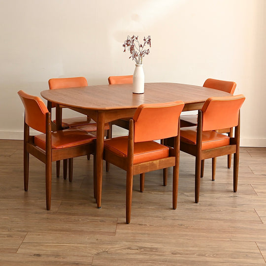 8x Mid Century Teak and Orange Vinyl Dining Chairs by Chiswell